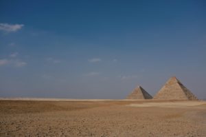 a group of pyramids in a desert