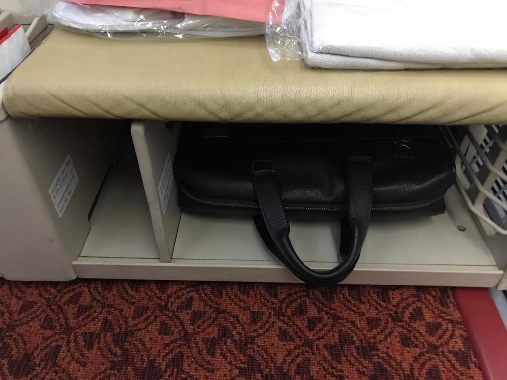 a black bag in a shelf