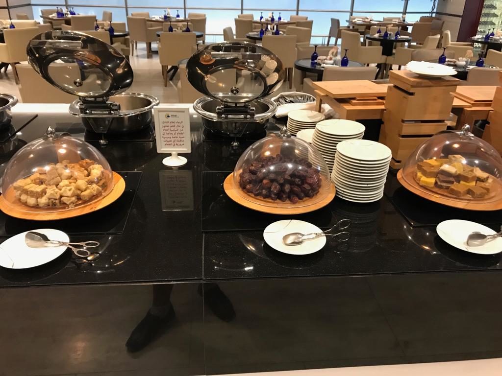 a buffet table with plates of food and plates of food